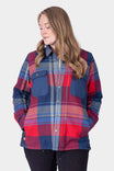 Dovetail Workwear Durham Reversible Quilted Shirt Jac in Barn Red Plaid shown on a woman wearing black pants, displaying the plaid flannel side with quilted panels and chest pockets