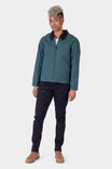 Woman wearing Dovetail Workwear Old School Trucker Canvas Work Jacket in Lodge Green with corduroy collar and dark jeans, shown from front