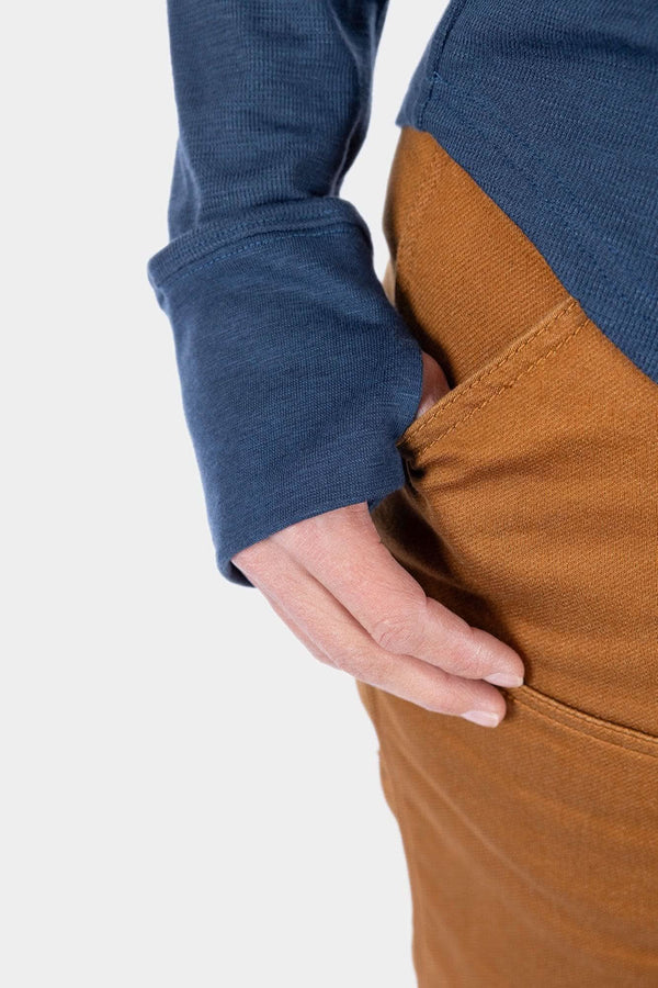 Detail view of the Honed Long Sleeve Thermal Henley by Dovetail Workwear in Atlantic Blue and Kodiak Brown, showing reinforced elbow and thumbhole features