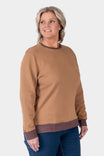 Dovetail Workwear GO TO™ Crew Sweatshirt in Saddle Brown/Kodiak Brown, shown on a woman from the front, featuring a relaxed fit crewneck with ribbed trim at the cuffs and hem.