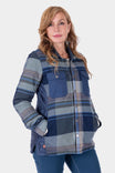 Woman wearing the Durham Reversible Quilted Shirt Jac by Dovetail Workwear in Loden Green Plaid or Barn Red Plaid, featuring quilted insulation and reinforced shoulders, with one hand in pocket