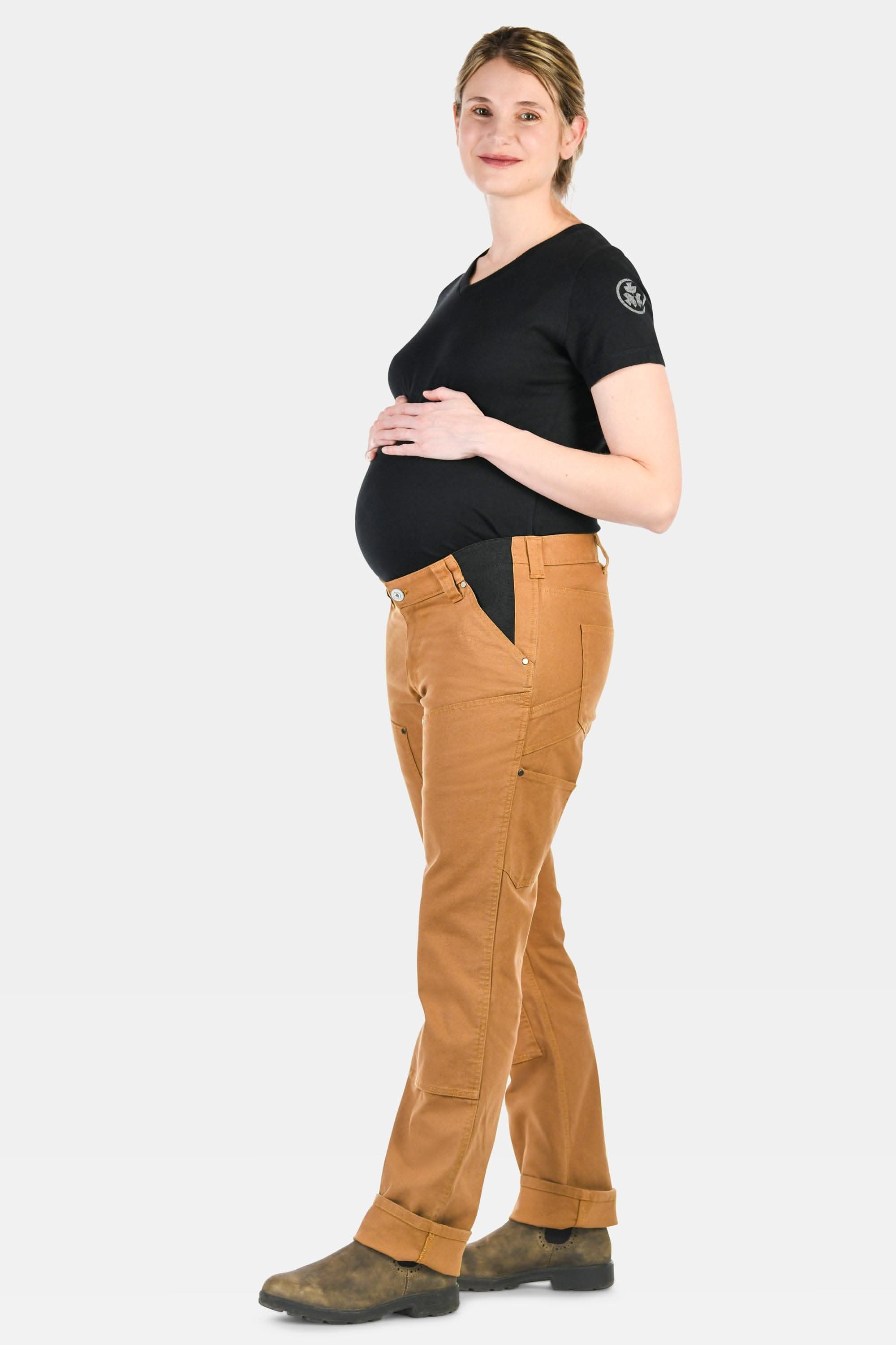 Pregnant woman wearing Anna Maternity Work Pants in Saddle Brown by Dovetail Workwear