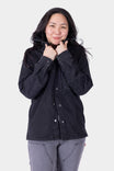 Black Oahe HOTSWAP™ Thermal Denim Work Jacket by Dovetail Workwear shown on a woman, featuring wind-resistant HotSwap™ stretch denim with reinforced elbows and multiple pockets