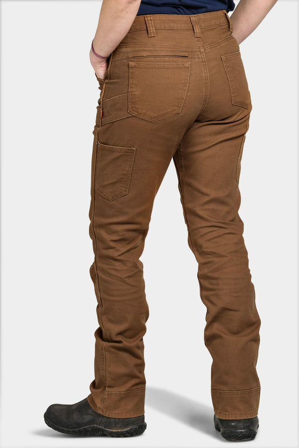 Back view of a woman wearing the Dovetail Workwear Britt Utility Pant in Saddle Brown Canvas, showcasing nested pockets, reinforced knees, and straight leg fit