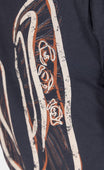 Detail view of the Rae Ripple x Dovetail Workwear Brave Wings T-Shirt in black, featuring ornate winged graphic design on the back.