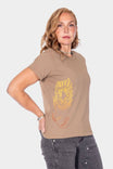 Rae Ripple x Dovetail Workwear You Will Be Art T-Shirt in Alloy Brown, shown on a woman from the side wearing the relaxed-fit cotton tee with handwritten text on the left sleeve