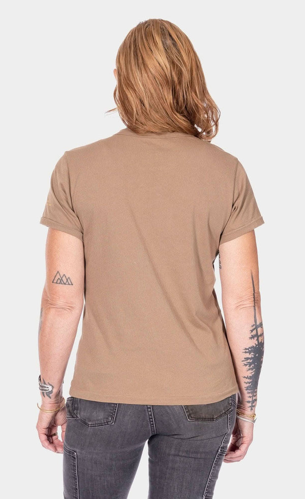 Back view of a woman wearing the Rae Ripple x Dovetail Workwear You Will Be Art T-Shirt in Alloy Brown, showcasing the relaxed fit and left sleeve text detail
