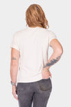 Back view of a woman wearing the Rae Ripple x Dovetail Workwear Love Language T-Shirt in buttermilk, showcasing the relaxed fit