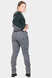 Back view of a woman wearing Dovetail Workwear's Freshley Drop Seat Overalls in Grey Stretch Thermal Denim, featuring Reinforced Knees and tool loops.