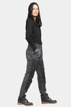 Side view of a woman wearing Dovetail Workwear's D-Fender Pant in Cement Grey Stretch Canvas with reinforced knees and straight leg fit