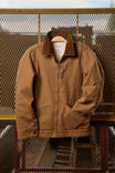 Dovetail Workwear Old School Trucker Canvas Work Jacket in Vintage Brown displayed on a hanger, showcasing the faux shearling collar, zip front closure, and deep front pockets