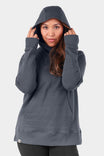 John Deere X Dovetail Workwear Early Bird Hoodie in Steel Grey, shown on a woman wearing the cowl neck hoodie with thumbholes and ponytail slit pulled up over her head