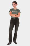 Woman wearing John Deere X Dovetail Workwear Into Town Bootcut Jeans in Classic Black with arms crossed, featuring mid-rise fit and bootcut leg