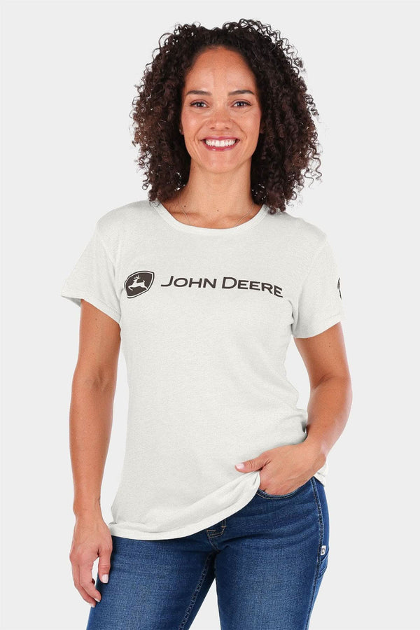 John Deere X Dovetail Workwear T-Shirt for Women in Heathered Ecru White, featuring the iconic John Deere logo and soft stretch cotton jersey fabric, shown on a smiling woman