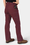 Back view of a woman wearing the Anna Taskpant in Elderberry Canvas by Dovetail Workwear, featuring multiple pockets, a relaxed leg fit, and visible Hip Slot™ Tool loop at the waist