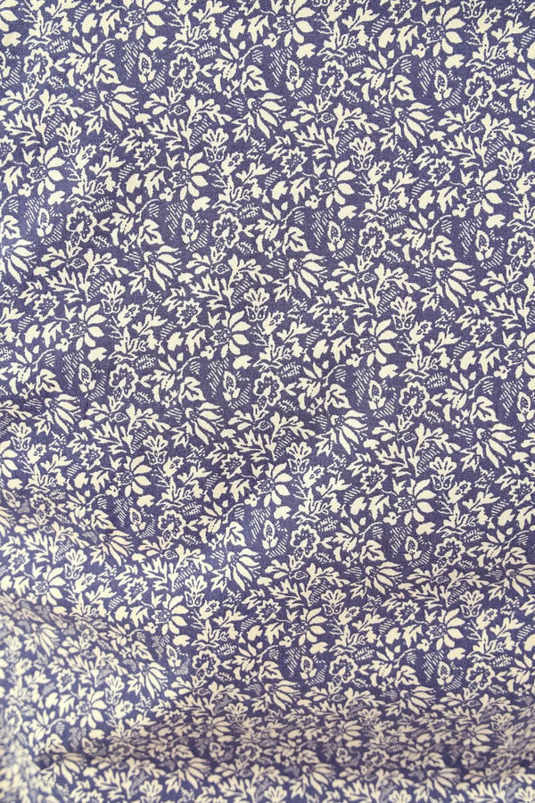 Close-up detail of the Navy Carver Work Shirt by Dovetail Workwear, showcasing the paisley print in cream on navy fabric