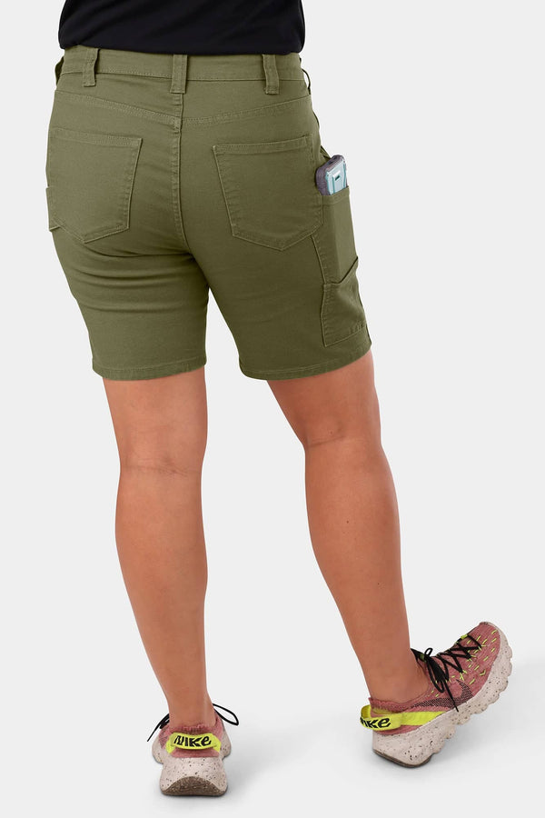 Back view of a woman wearing Dovetail Workwear GO TO™ Stretch Canvas Short in Kelp Green, highlighting the tool loop and pockets