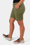 Side view of a woman wearing Dovetail Workwear GO TO™ Stretch Canvas Short in Kelp Green, featuring a 7.5" inseam and tool loop detail