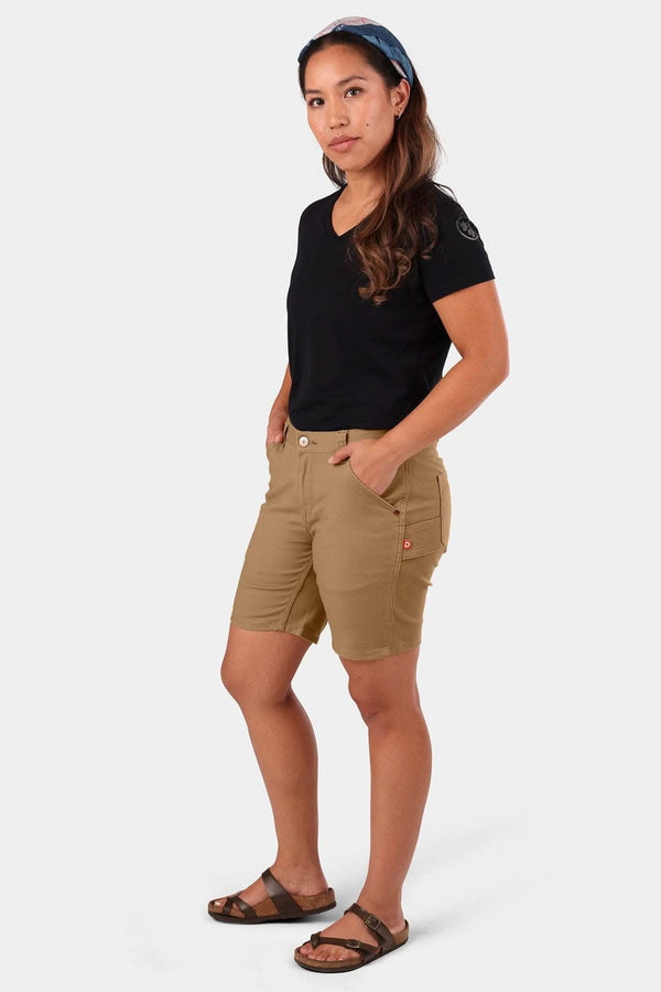 Sawdust Brown GO TO™ Stretch Canvas Shorts by Dovetail Workwear worn by a woman, showcasing the mid-rise fit, 7.5" inseam, and functional pockets from a side angle