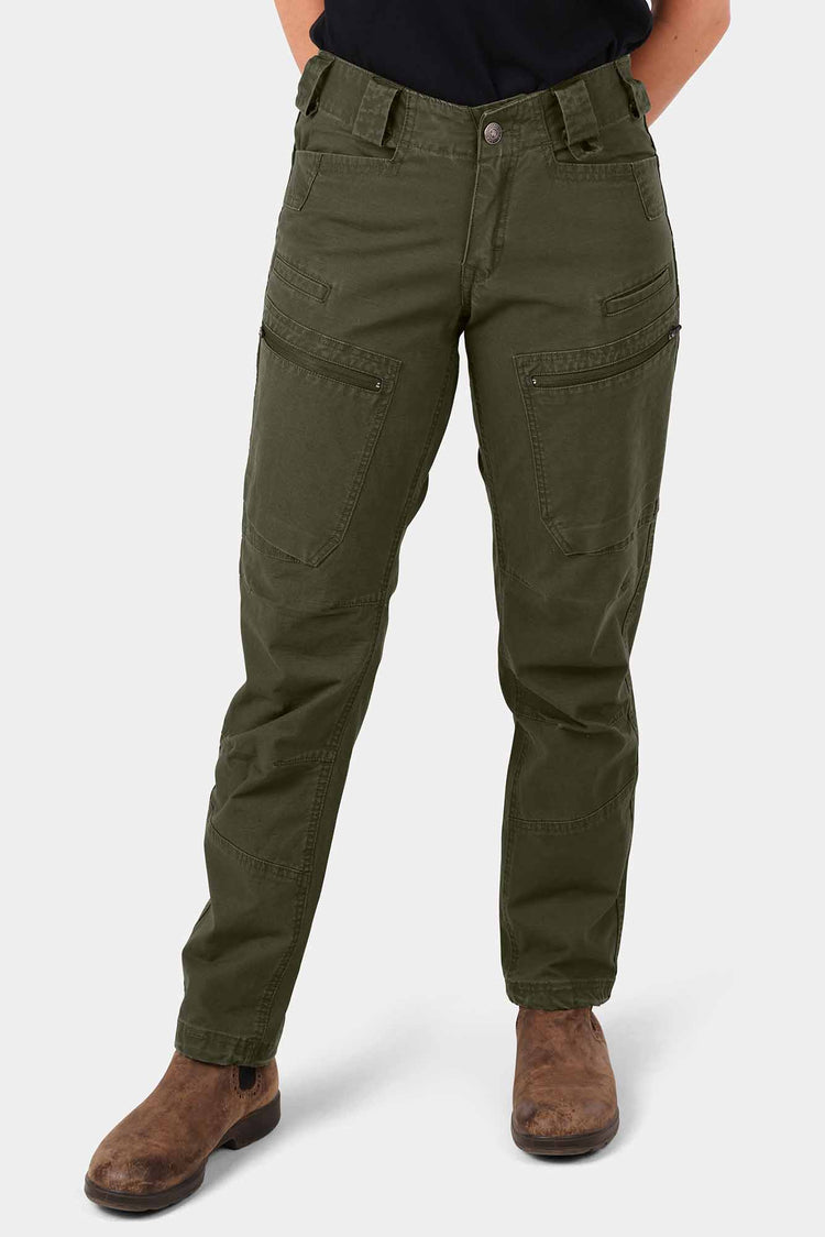 Dovetail Workwear Provisions Lightweight Ripstop Cargo Pant in Moss Green, featuring multiple cargo pockets and articulated knees, worn by a woman with adjustable cuffs visible at the ankles