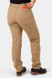 Back view of a woman wearing Dovetail Workwear Provisions Lightweight Ripstop Cargo Pant in Tan Sandstone, featuring cargo pockets and relaxed leg fit