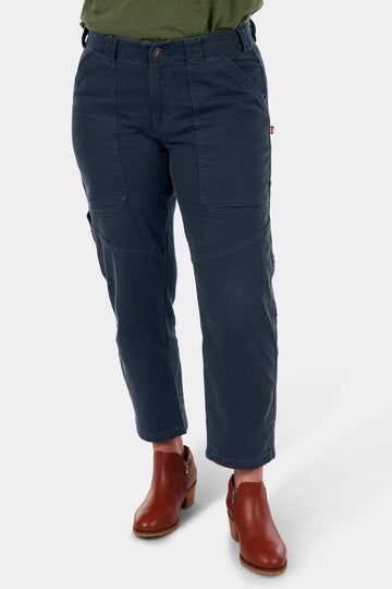 Navy Range Crop Pant in Lightweight Denim by Dovetail Workwear, worn by a woman with visible bellowed front pockets and cropped inseam, paired with brown ankle boots