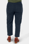 Back view of a woman wearing Dovetail Workwear Range Crop Pant in Navy lightweight denim with bellowed front pockets and cropped inseam