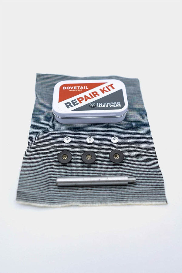 Dovetail Workwear Repair Kit displayed flat with tin container, metal hip buttons, metal clasps, and fabric swatch for DIY workwear repairs