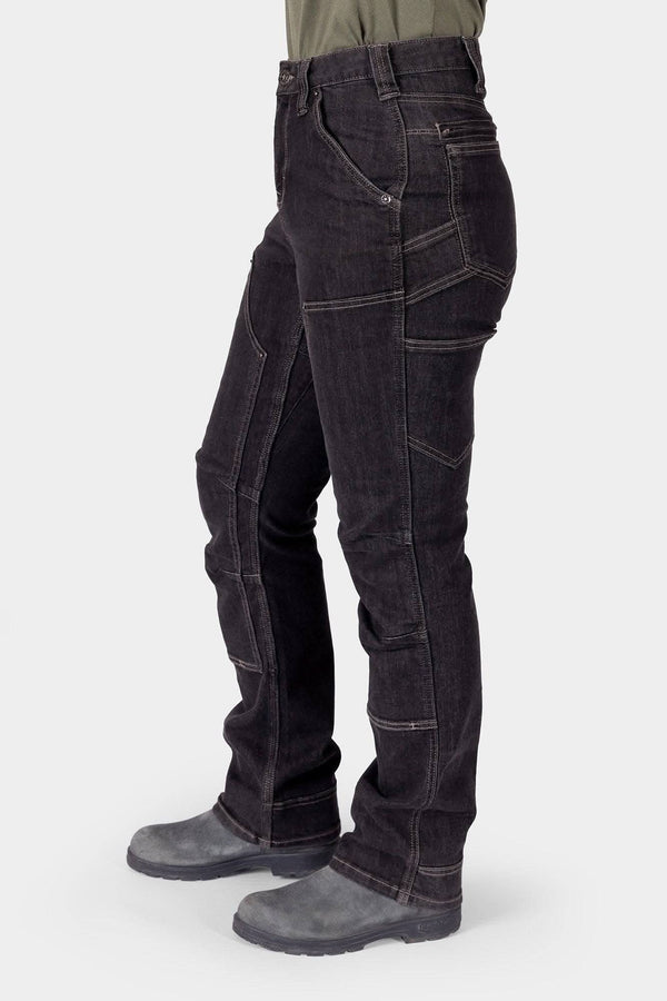 Side view of a woman wearing Dovetail Workwear's Old School High Rise Graphene Denim Pant in Heather Black, showcasing the straight leg fit, nested pockets, and crotch gusset detail