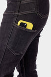 Detail view of the Old School High Rise Graphene Denim Pant by Dovetail Workwear in Heather Black, highlighting the phone pocket with a yellow phone case visible