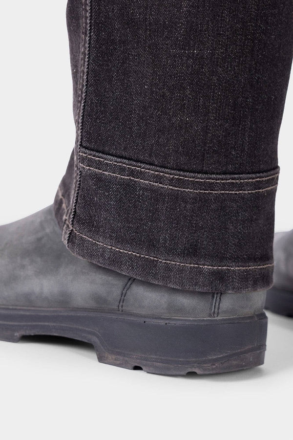 Close-up detail of the cuff on Dovetail Workwear's Old School High Rise Graphene Denim Pant in Heather Black, showing the Tough Cuff™ reinforced hem and durable construction