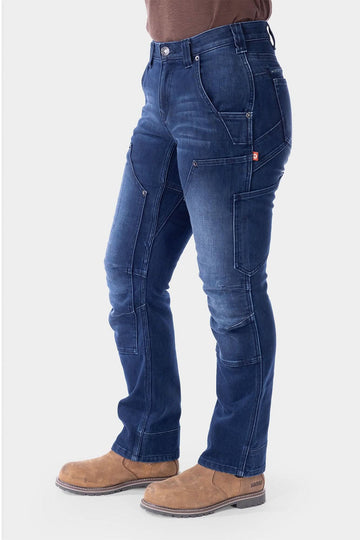 Indigo Britt X Graphene Denim Pant by Dovetail Workwear shown on a woman, featuring cargo-style pockets, crotch gusset, and reinforced panels in a straight-leg silhouette