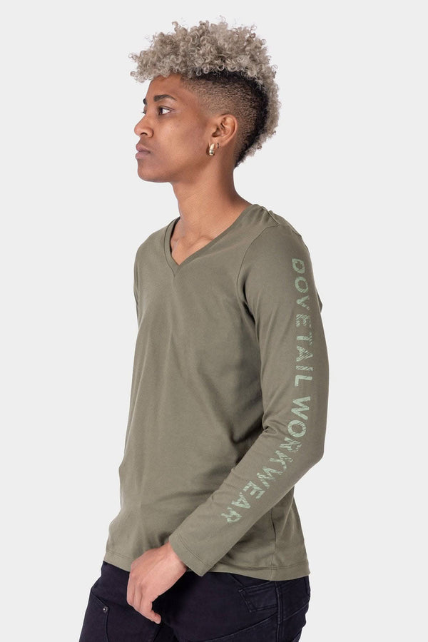 Side profile of a woman wearing the GO TO™ Long Sleeve V-Neck T-Shirt in Kelp Green, featuring a relaxed fit and V-neckline.