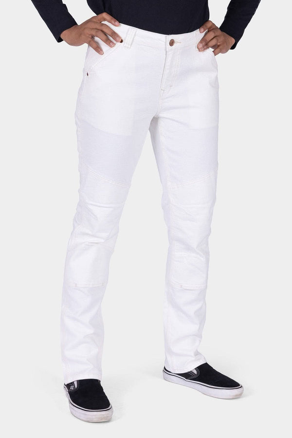 Front view of a woman wearing Dovetail Workwear's GO TO™ Stretch Canvas Work Pant in Painter's White, featuring articulated knees and deep pockets, paired with black slip-on shoes