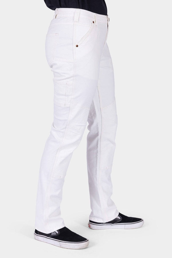 Side view of a woman wearing Dovetail Workwear GO TO™ Stretch Canvas Work Pant in Painter's White with visible tool loop and deep pockets
