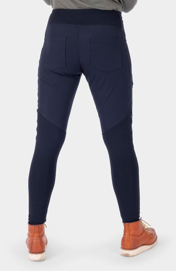 Back view of a woman wearing the Field Utility Legging in Black by Dovetail Workwear, showing back pockets and slim leg fit with nylon reinforcements