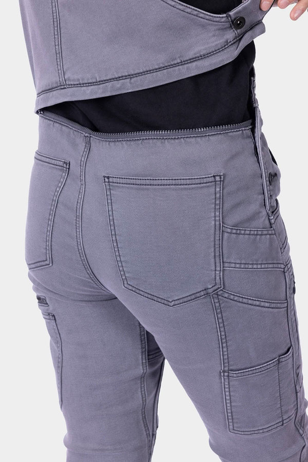 Back view of Dovetail Workwear's Freshley HOTSWAP™ Drop Seat Thermal Denim Overalls in Grey, highlighting the hidden zip drop seat and reinforced front pockets.