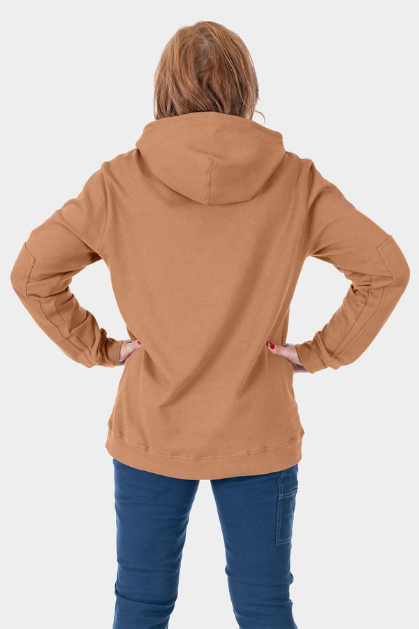 Back view of a woman wearing the Dovetail Workwear GO TO™ Hoodie in Saddle Brown with navy jeans, showing the relaxed fit and front kangaroo pocket