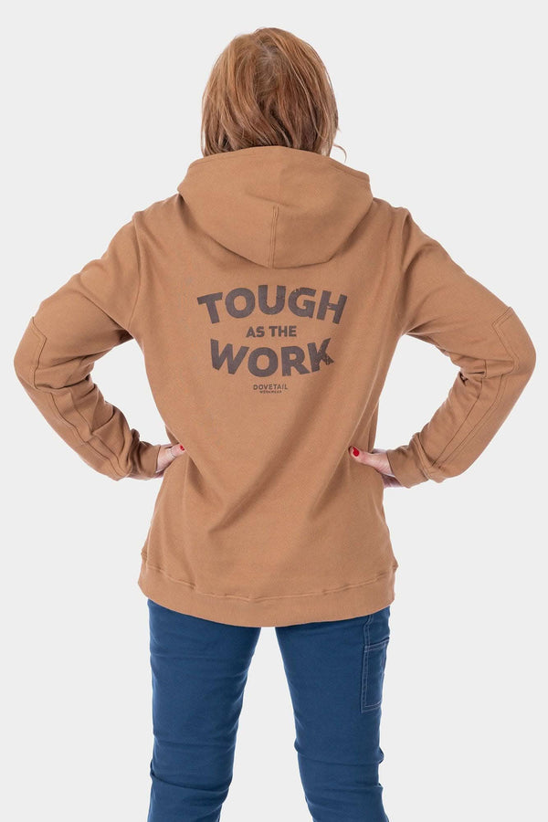 Back view of a woman wearing the Dovetail Workwear GO TO™ Graphic Hoodie in Saddle Brown, featuring a graphic on the back and a relaxed fit design