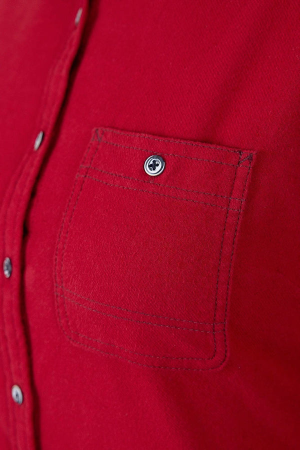 Close-up detail of the Givens Stretch Chamois Work Shirt in Barn Red by Dovetail Workwear, showing the buttoned chest pocket with contrast stitching and brushed chamois fabric