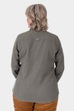 Back view of a woman wearing the Givens Stretch Chamois Work Shirt in Patina Green with a locker loop visible, paired with tan pants