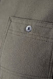 Close-up detail of the buttoned chest pocket on the Givens Stretch Chamois Work Shirt in Patina Green