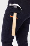 Detail shot of Dovetail Workwear's Maven X Graphene Denim Pant in Black, highlighting the tool loop and reinforced front pocket on a woman wearing work pants