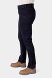 Side view of a woman wearing Dovetail Workwear's Maven X Graphene Denim Pant in black, featuring a slim leg and mid-rise fit with visible tool loops and reinforced pockets