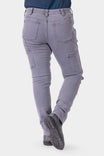 Back view of a woman wearing Dovetail Workwear's Maven X HOTSWAP™ Thermal Denim Pant in grey, showcasing Hip Slot™ pockets, reinforced stitching, and slim fit design