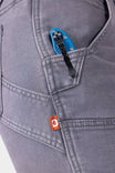 Close-up detail of the Maven X HOTSWAP™ Thermal Denim Pant in Grey by Dovetail Workwear, showing the Hip Slot™ feature with thermal insert and brand label on pocket