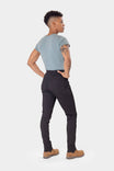 Back view of a woman wearing Dovetail Workwear's Christa X DIY Pant in Black Performance Modal with high-rise waistband and reinforced knees