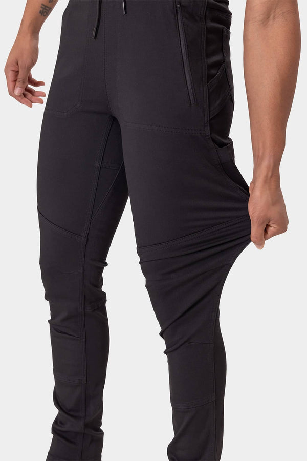 Back view of a woman wearing the Christa X DIY Pant in Black Performance Modal by Dovetail Workwear, highlighting reinforced knees and articulated design
