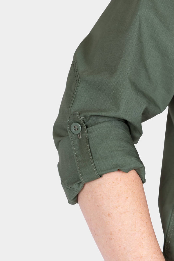 Close-up detail of the cuff tab and button on the Aventurine Green AJ COOLSWAP™ Work Shirt, shown on a woman's arm