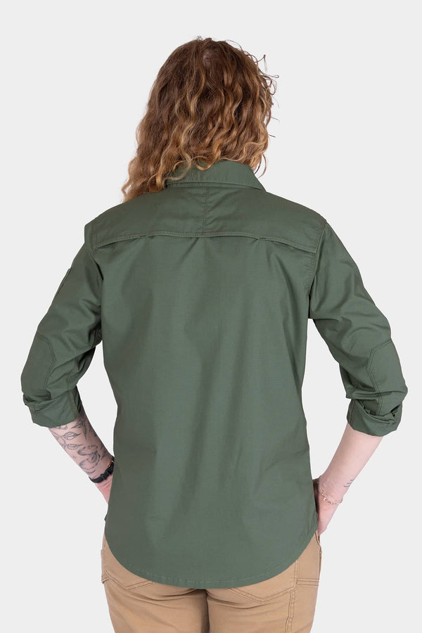 Back view of a woman wearing the Dovetail Workwear AJ COOLSWAP™ Work Shirt in Aventurine Green, showcasing the back yoke vent and reinforced elbows